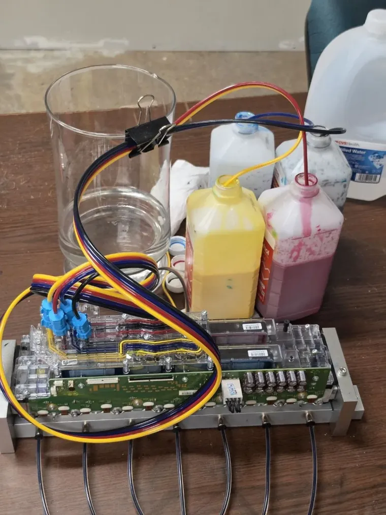 HP FI-1000 printhead assembly on the InkBags service bench during an ink system flush
